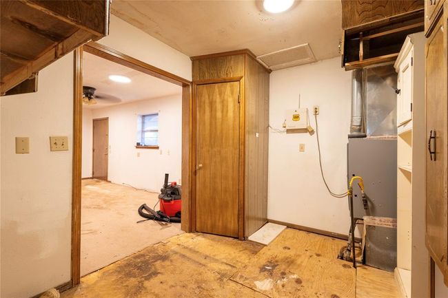 Utility room with electric water heater | Image 26