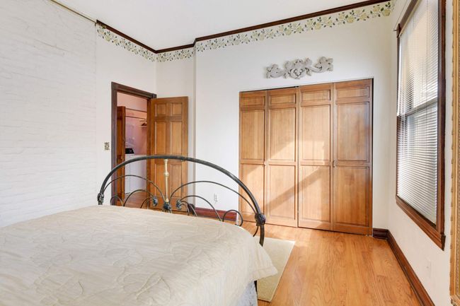 A double closet offers plenty of storage space. There's also room for a chair and small table to make a comfy reading nook near the window. | Image 16
