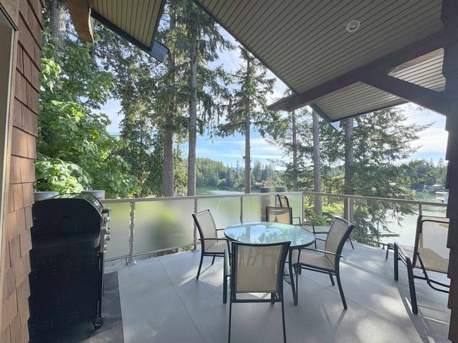 View of patio / terrace featuring area for grilling and outdoor dining area | Image 11