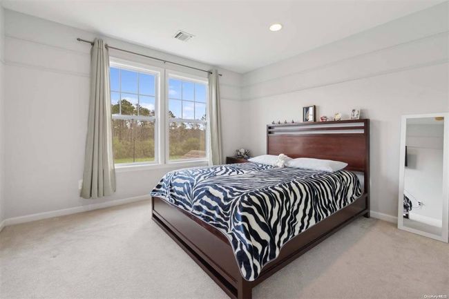 Bedroom featuring carpet floors, baseboards, and recessed lighting | Image 12