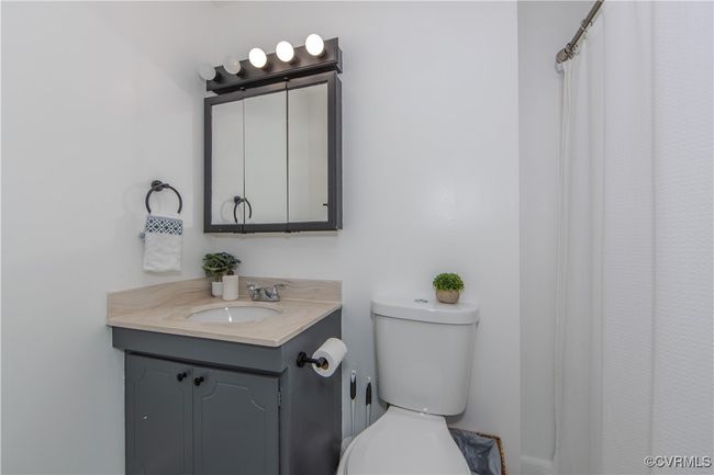 Bathroom featuring vanity and toilet | Image 28