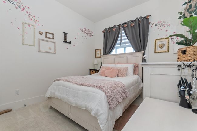 Bedroom featuring baseboards and carpet | Image 22