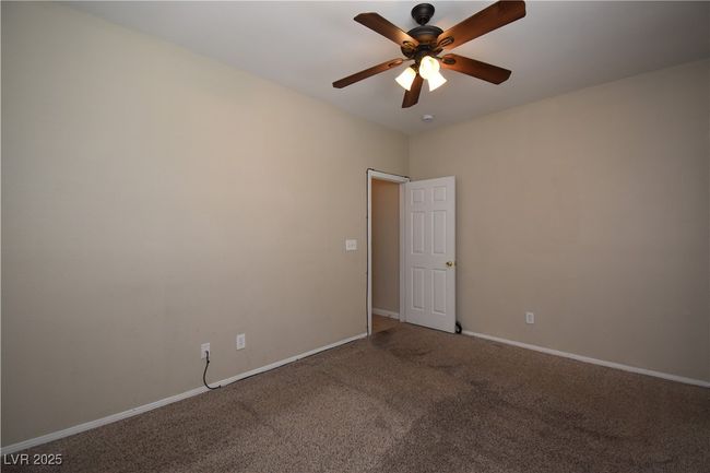 Unfurnished room featuring carpet, a ceiling fan, and baseboards | Image 13