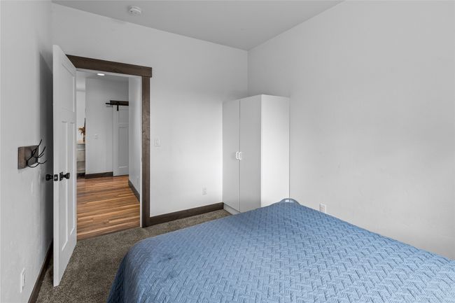 Carpeted bedroom featuring baseboards | Image 21