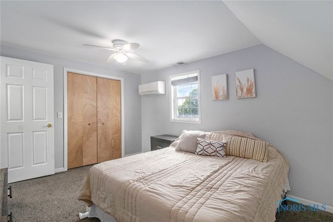 upstairs bedrooms offers generous space, a large closet for ample storage, and a newer mini split system to keep the room comfortable year-round. It’s an ideal retreat | Image 14