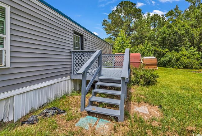 Rear view of property featuring a lawn | Image 30