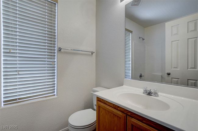 Bathroom with walk in shower, toilet, visible vents, and vanity | Image 21