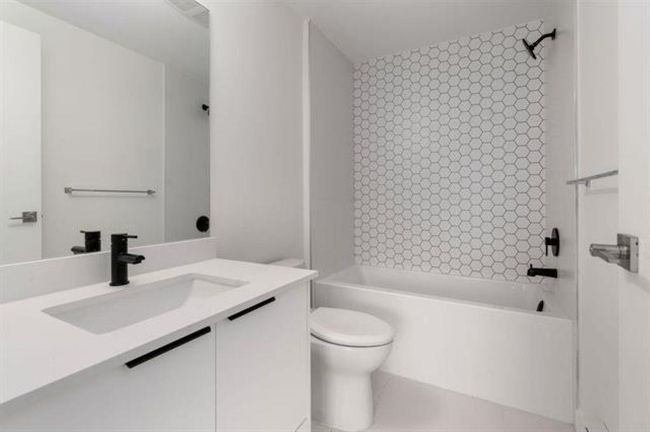 Full bath with vanity, toilet, and bathing tub / shower combination | Image 15
