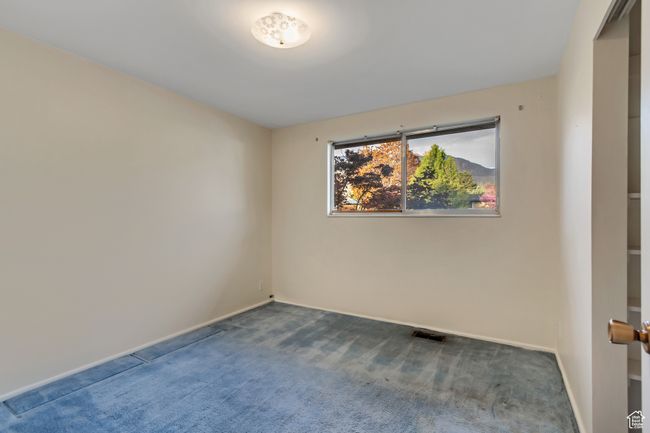 Empty room with baseboards, visible vents, and carpet floors | Image 18