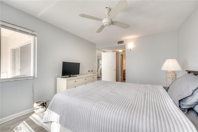 Bedroom with ceiling fan and light hardwood / wood-style flooring | Image 27
