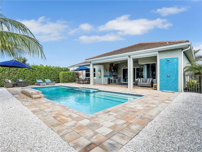 View of swimming pool featuring outdoor lounge area and a patio | Image 34