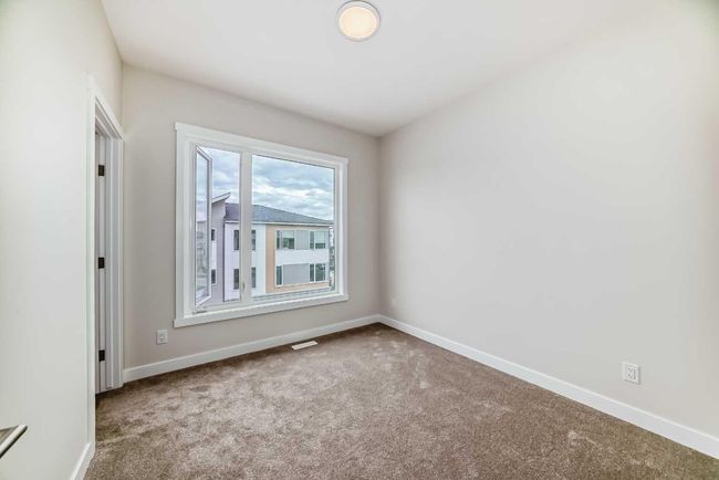 214 Shawnee Square Sw, Townhouse with 2 bedrooms, 3 bathrooms and 3 parking in Calgary AB | Image 24