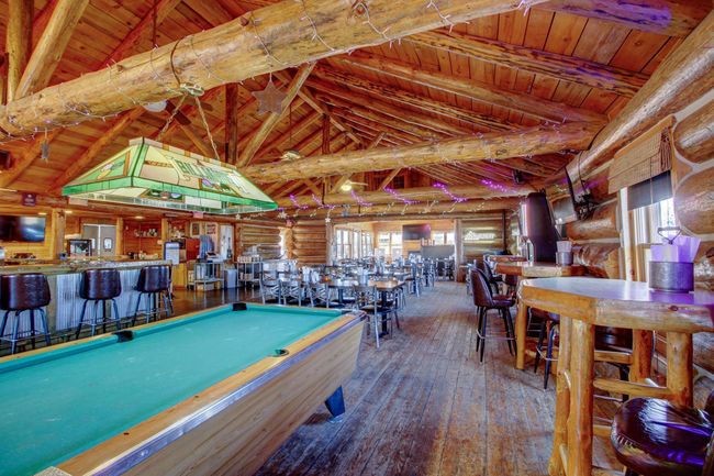 View of high top tables and interior of restaurant | Image 5