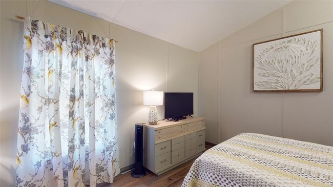 Bedroom featuring vaulted ceiling and dark wood-style floors | Image 28
