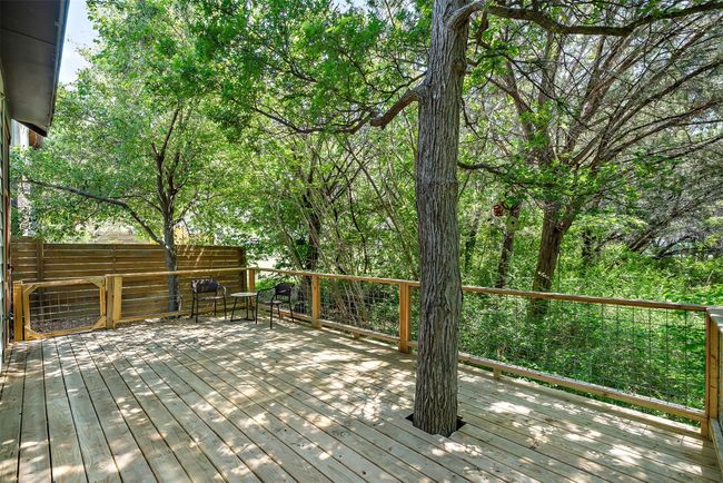 Newly updated, the deck is designed to blend seamlessly with the home's interior, offering an inviting outdoor living space that feels like a natural extension of your home | Image 35