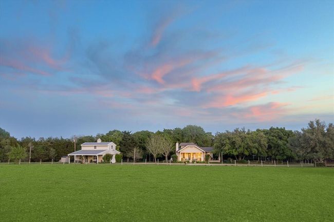 Distance view of the home and garage. | Image 45