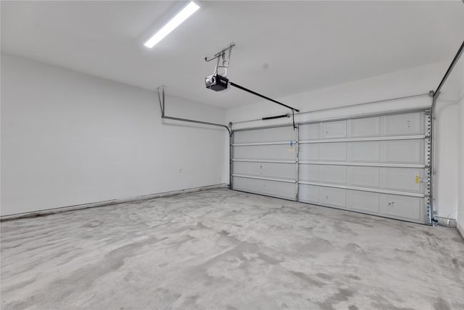 Garage featuring a garage door opener | Image 33