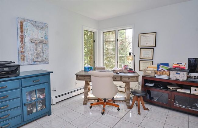 Tiled home office featuring baseboard heating | Image 24