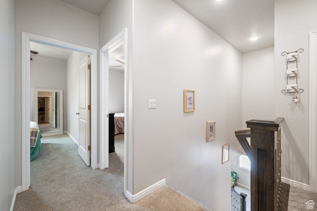 Hallway with carpet flooring and an upstairs landing | Image 15