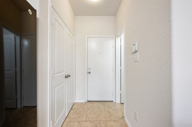 Hall featuring light tile patterned floors | Image 19