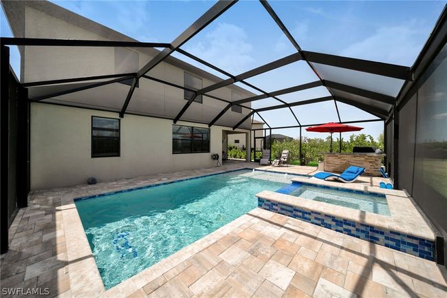View of pool with a patio, an in ground hot tub, and a lanai | Image 27