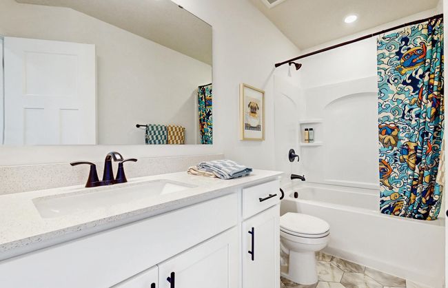(Photo of a model home, actual features may vary) The spacious upper level bath provides plenty of space for everyone to get ready during those busy mornings. | Image 15