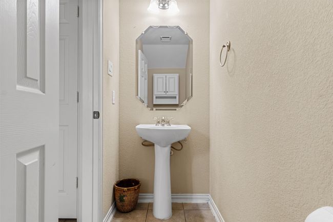 Bathroom with tile patterned floors, baseboards, and a sink | Image 22
