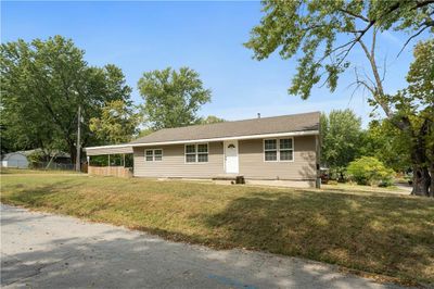 Single story home featuring a front yard | Image 1