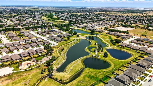 Aerial view of property's location with nearby suburban area and a nearby body of water | Image 22