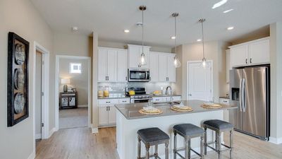 Ample countertop space and a large corner pantry. Model photo. Options and colors will vary. See listing agent for home specific selections. | Image 3