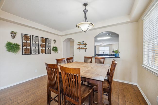 Dining room with view into the kitchen, perfect for entertaining! | Image 5
