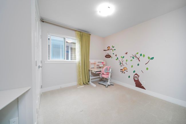 Playroom with light colored carpet and baseboards | Image 17