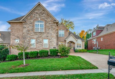 Great curb appeal thanks to all brick and stone exterior and manicured landscaping. | Image 2