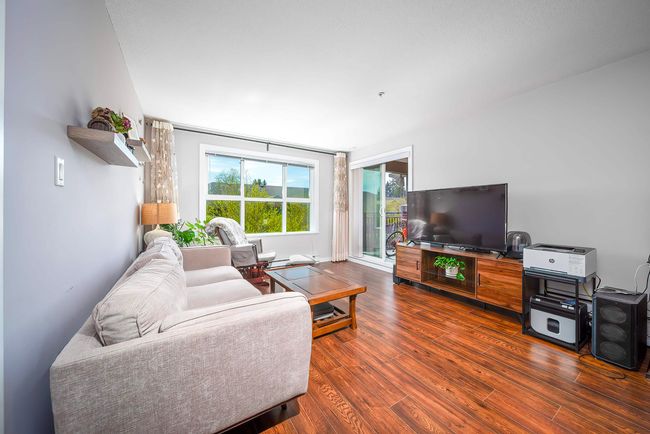 Living area featuring dark wood-type flooring | Image 11
