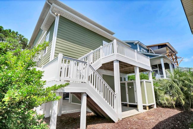 View of side of home featuring a wooden deck and stairway | Image 25