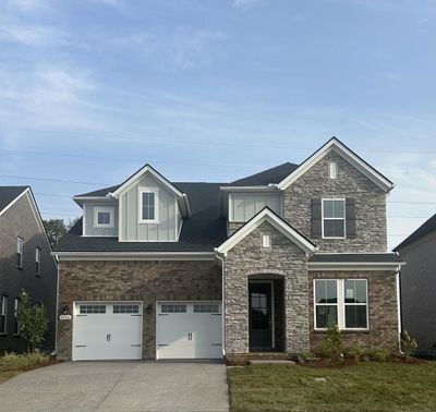 Gorgeous Weston Floorplan with 2 story great room and dual primary suites ready NOW!! Photo is of actual home. | Image 1