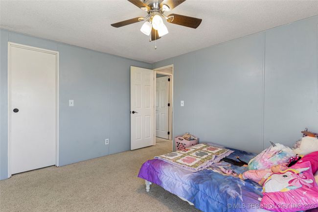 This bedroom features a walk in closet as well | Image 31