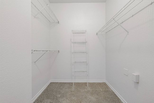 Spacious closet featuring carpet floors | Image 13