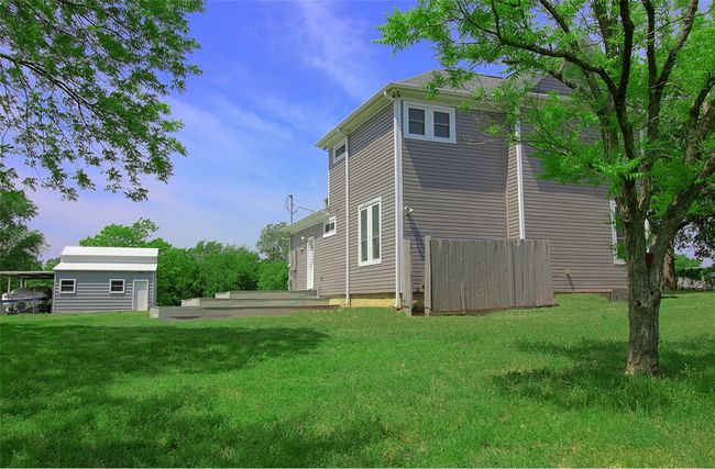 Back of house featuring an outbuilding and a yard | Image 24