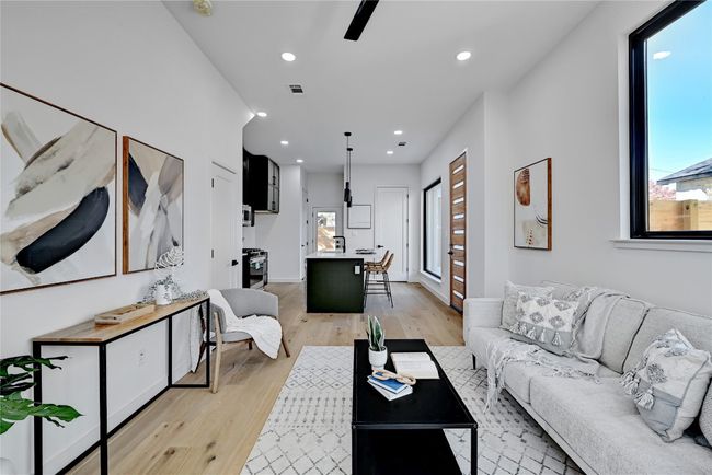 Living room with light wood-type flooring | Image 6