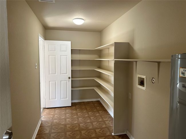 Large storage just off the kitchen. Entry from the garage. | Image 28