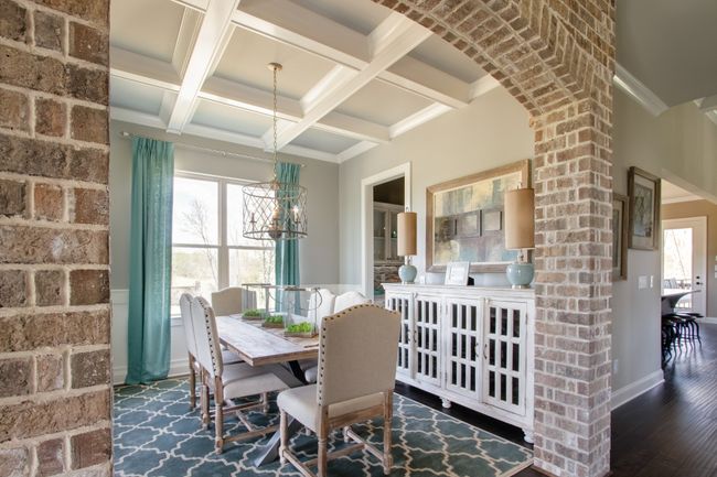 The dining room includes a beautiful coffered ceiling. | Image 10