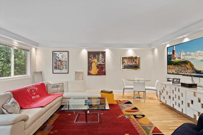 Living area with wood finished floors | Image 9