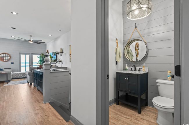 Bathroom with wood finished floors, vanity, ceiling fan, toilet, and recessed lighting | Image 14