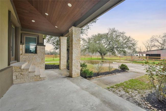 Back porch with access from the family room as well as the primary bedroom. | Image 28