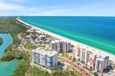 Bird's eye view featuring a beach view and a water view | Image 1