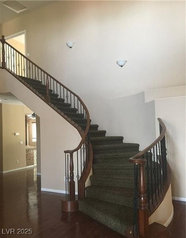 Stairway featuring wood finished floors and baseboards | Image 7