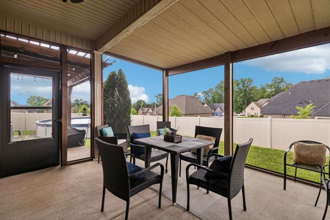 Step out onto the screened-in patio overlooking the backyard, perfect for relaxing in comfort. 1107 Sycamore Leaf Way Murfreesboro, TN 37129 | Image 32