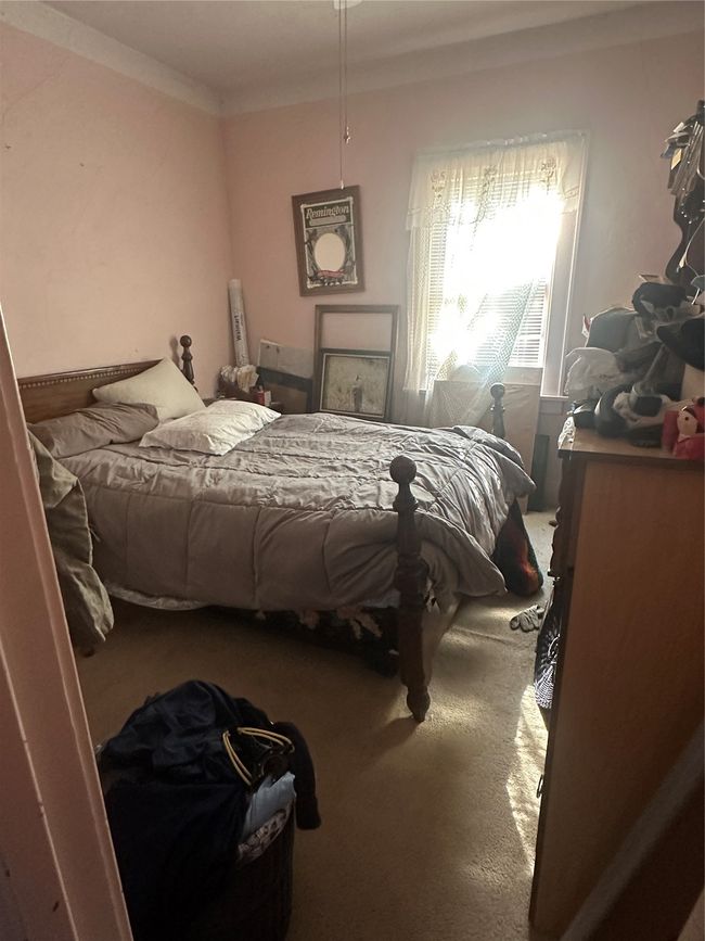 Carpeted bedroom with ornamental molding | Image 15