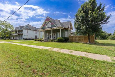 Victorian-style house with a front yard | Image 2